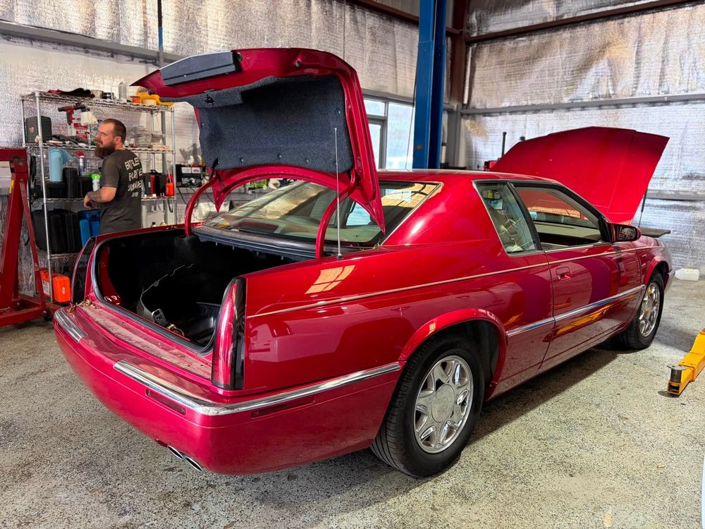 Red Cadillac Eldorado opened up for electrical and overheating diagnostics in North Little Rock, Arkansas