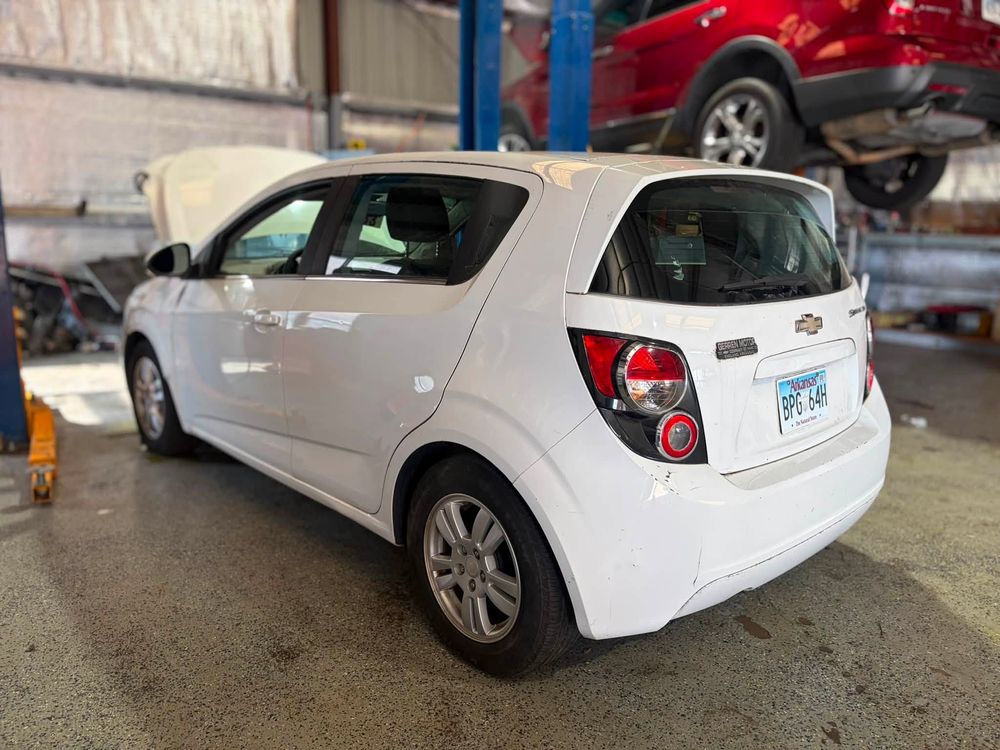 White Chevy Sonic in the shop bay during repairs in North Little Rock, Arkansas