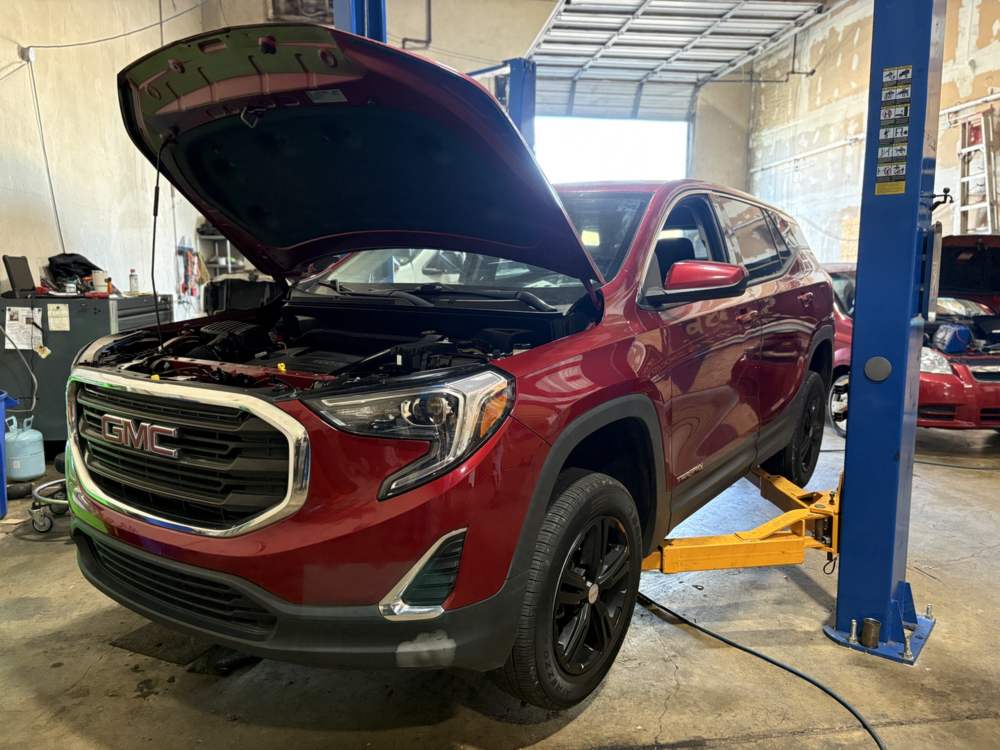 GMC Terrain with the hood up for AC system service in North Little Rock, Arkansas