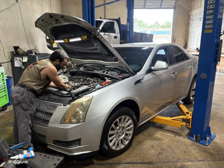 Cadillac CTS under the hood for scheduled maintenance in North Little Rock, Arkansas